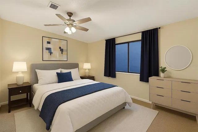 a bedroom with a bed and a dresser