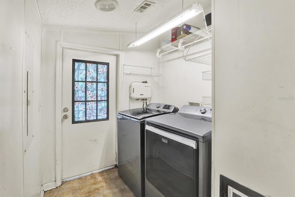 9211 Harney Baptist Church Road Tampa, FL 33637 - Photo 16 of 22 a kitchen with a stove and a microwave