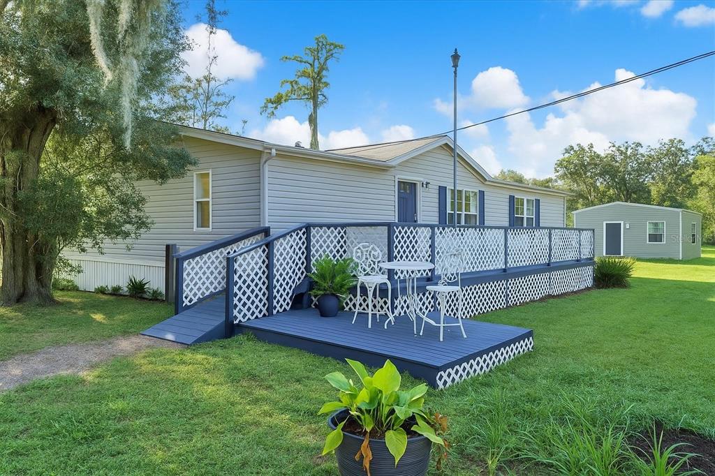 9211 Harney Baptist Church Road Tampa, FL 33637 - Photo 3 of 22 a view of a house with a backyard