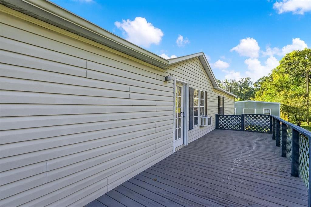 9211 Harney Baptist Church Road Tampa, FL 33637 - Photo 4 of 22 a view of a house with a deck