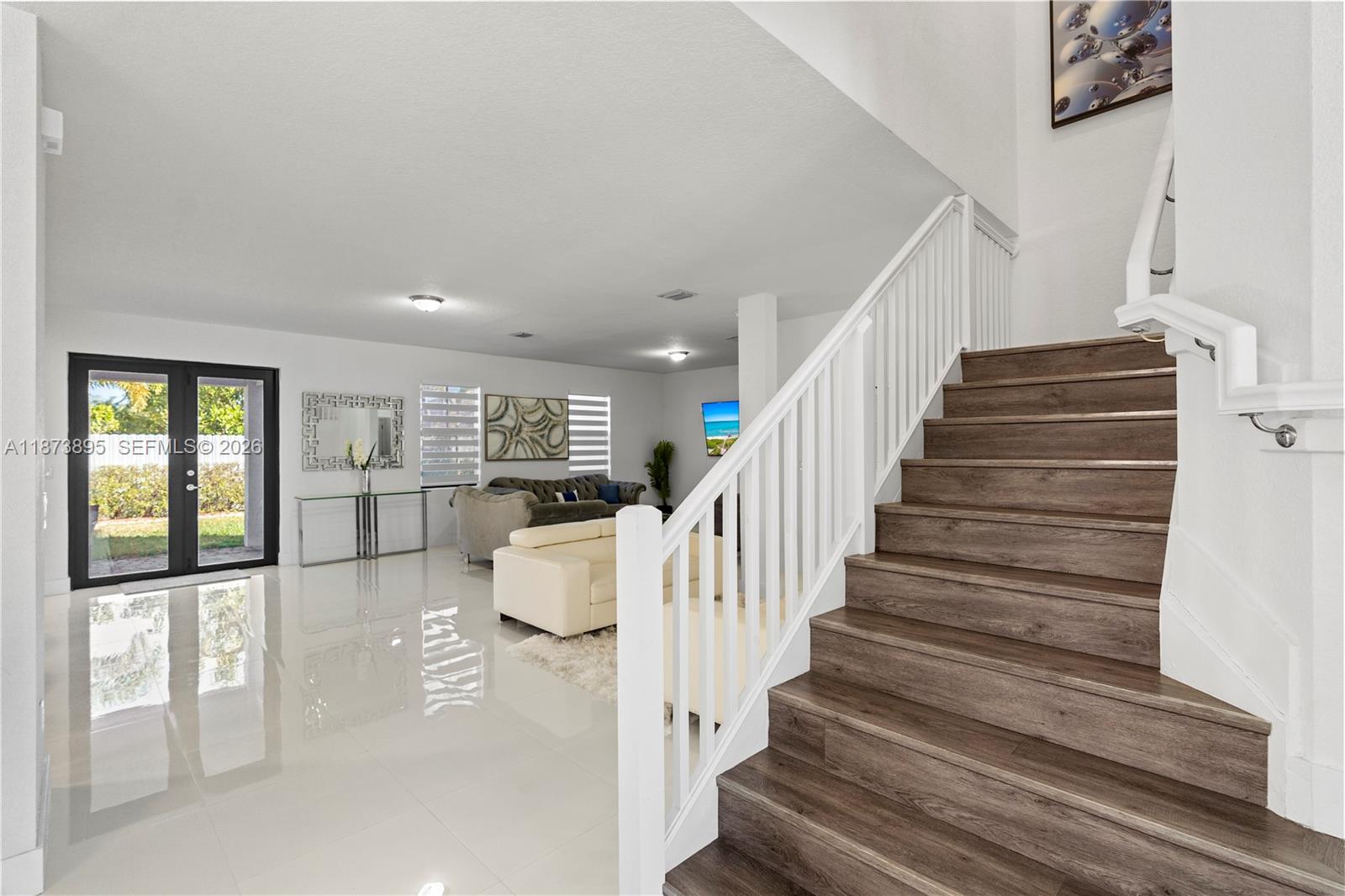 14841 Southwest 39th Terrace Miami, FL 33185 - Photo 12 of 57 a view of entryway and hall with wooden floor