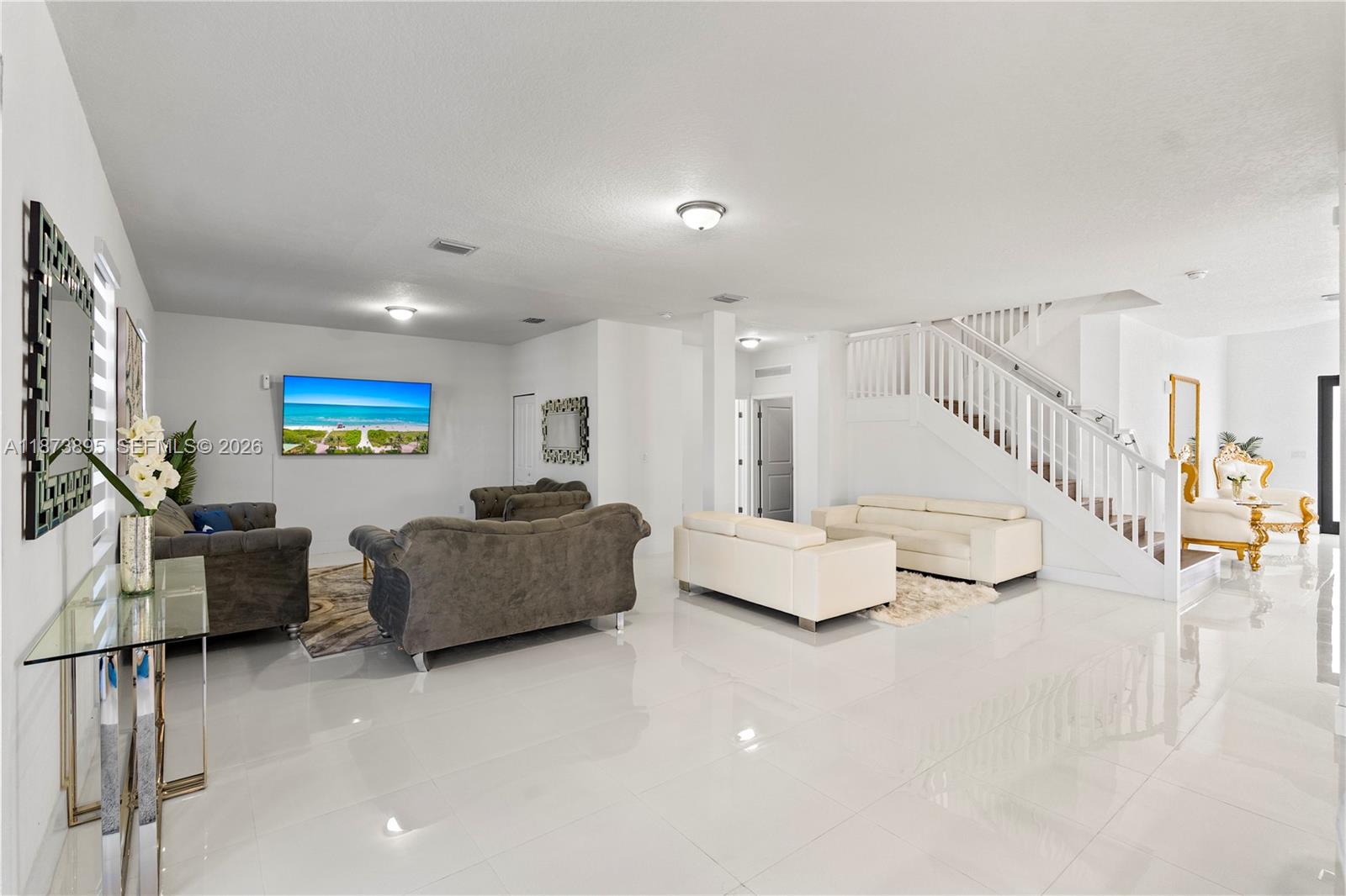 14841 Southwest 39th Terrace Miami, FL 33185 - Photo 15 of 57 a living room with furniture and a flat screen tv