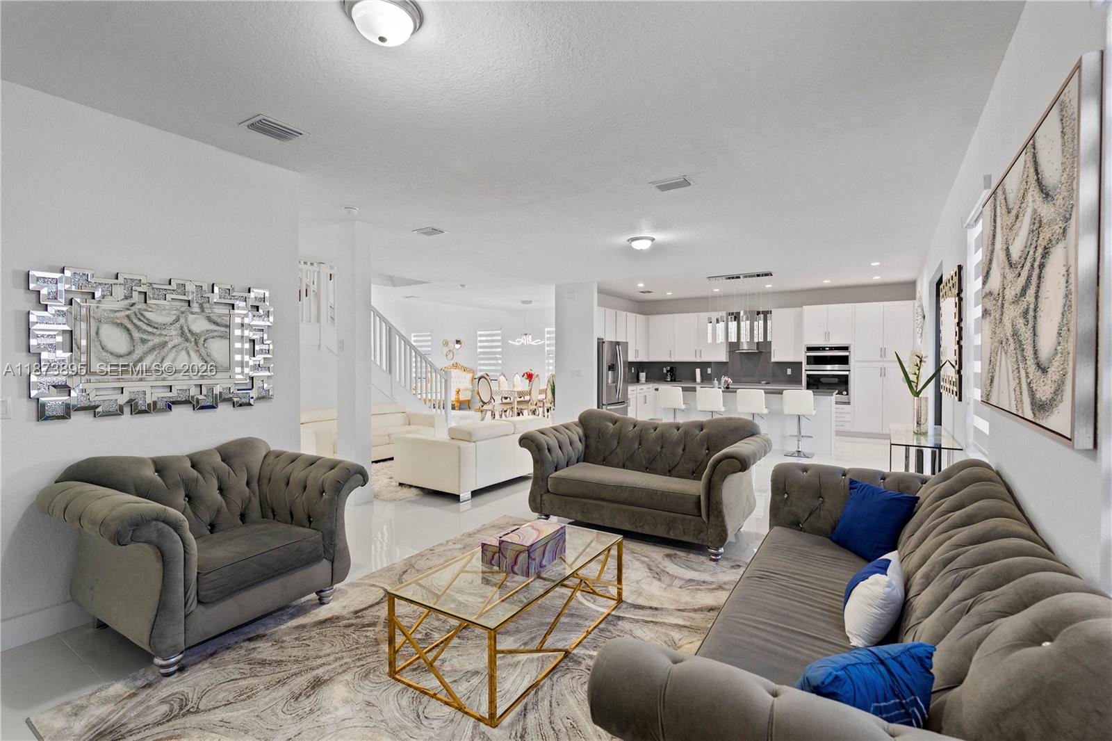 14841 Southwest 39th Terrace Miami, FL 33185 - Photo 16 of 57 a living room with furniture and a view of kitchen