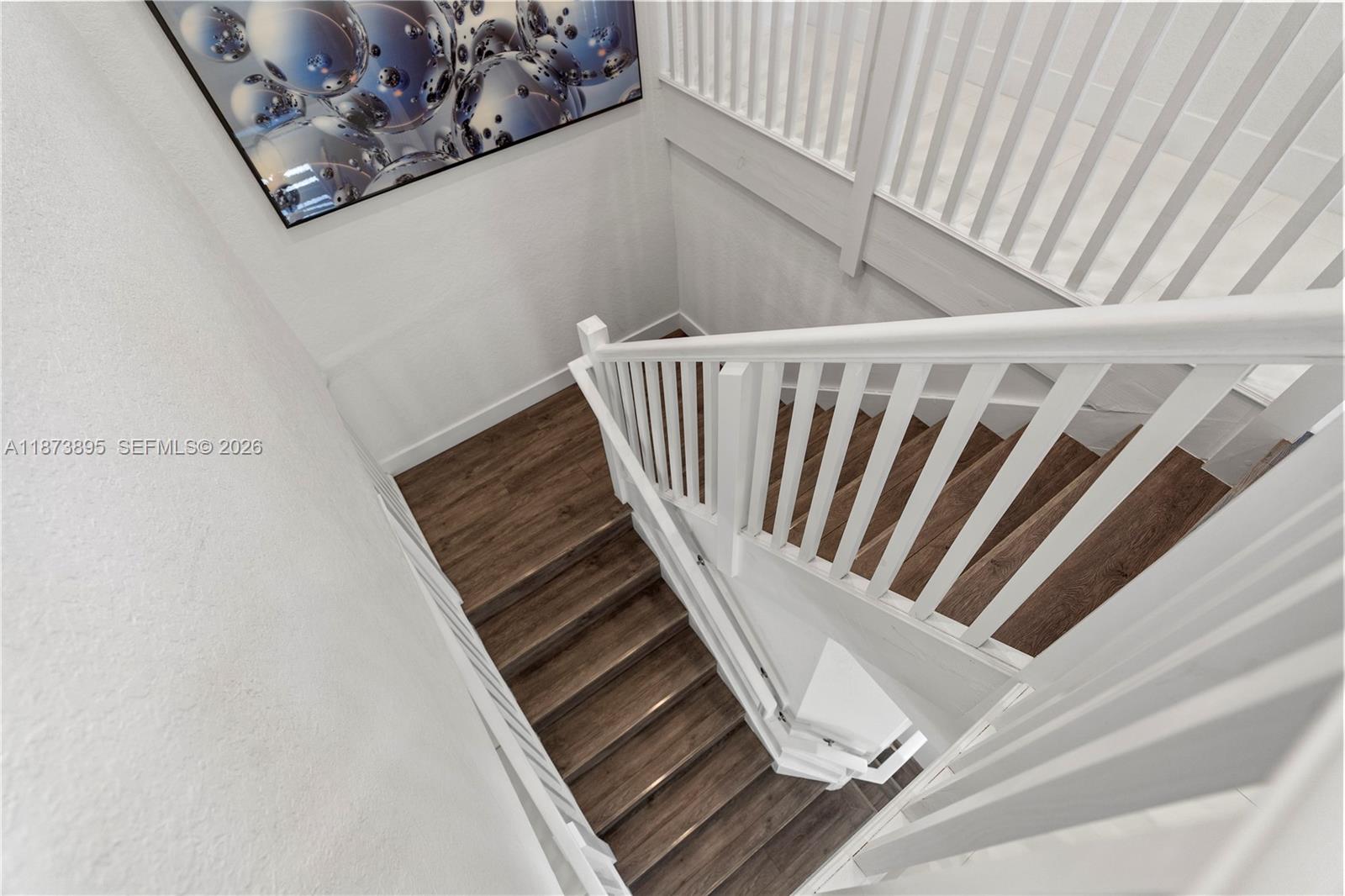 14841 Southwest 39th Terrace Miami, FL 33185 - Photo 25 of 57 a view of staircase with white walls and a window