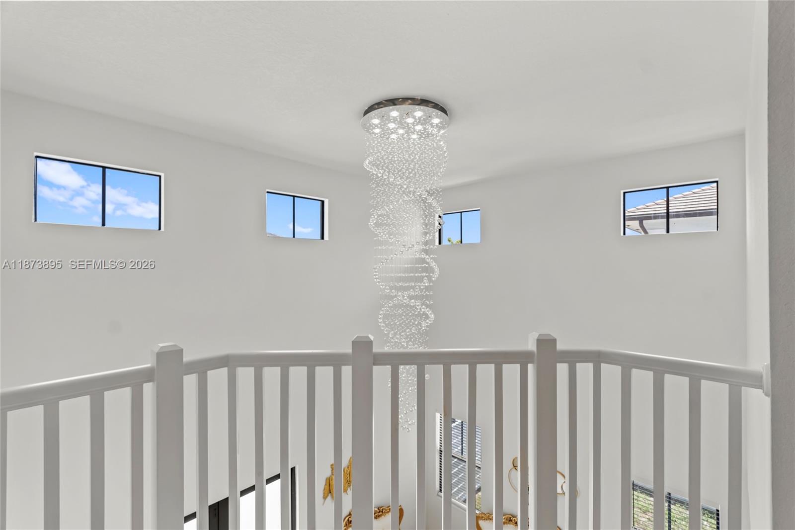 14841 Southwest 39th Terrace Miami, FL 33185 - Photo 31 of 57 a view of a hallway with wooden floor