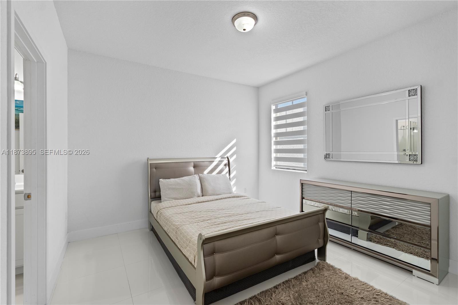 14841 Southwest 39th Terrace Miami, FL 33185 - Photo 40 of 57 a living room with furniture and a fireplace