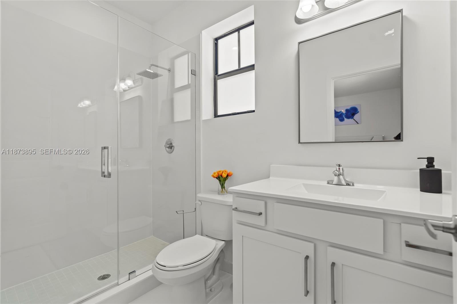 14841 Southwest 39th Terrace Miami, FL 33185 - Photo 46 of 57 a bathroom with a toilet sink and mirror