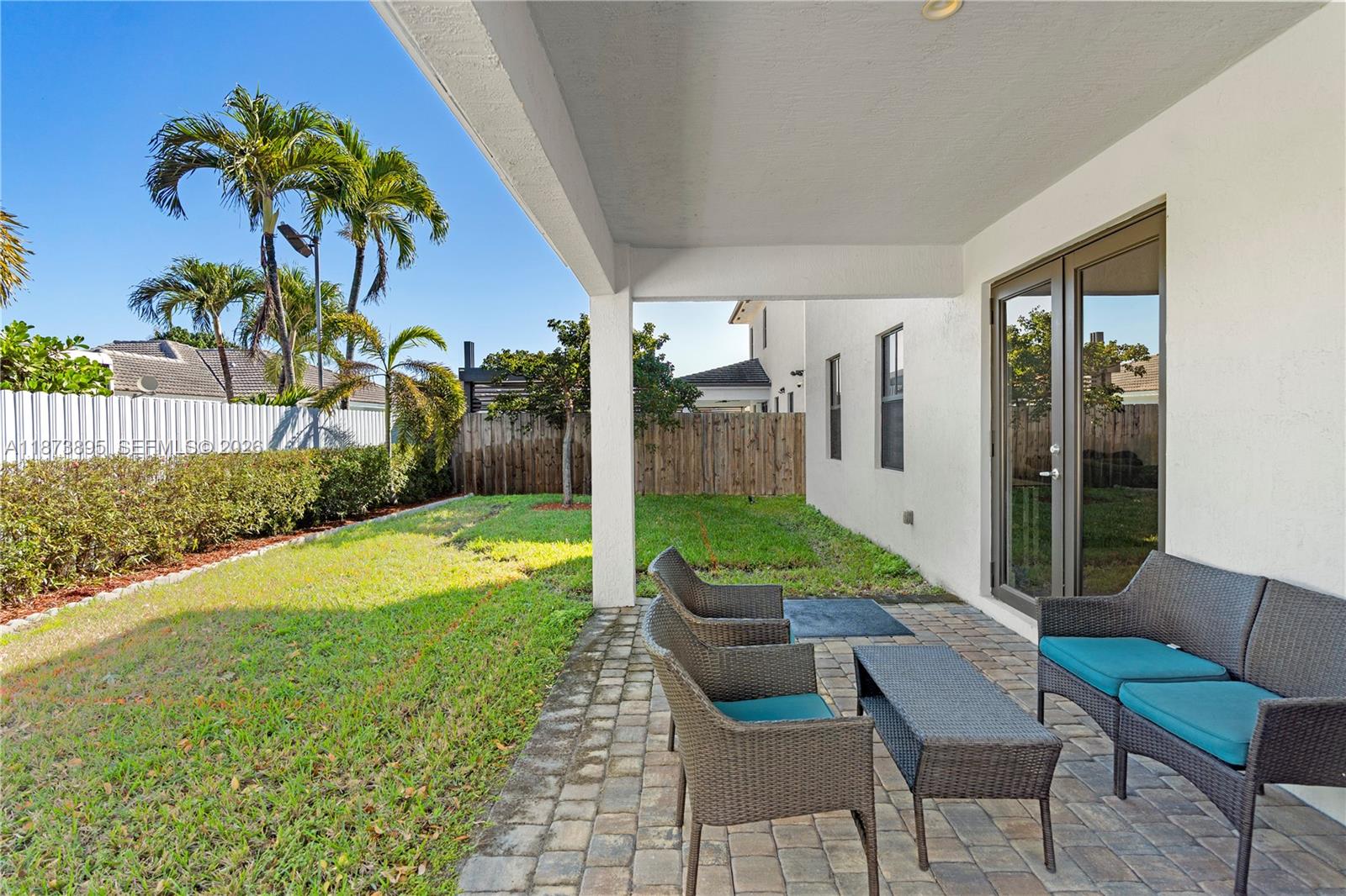14841 Southwest 39th Terrace Miami, FL 33185 - Photo 48 of 57 a view of a backyard with a patio and swimming pool