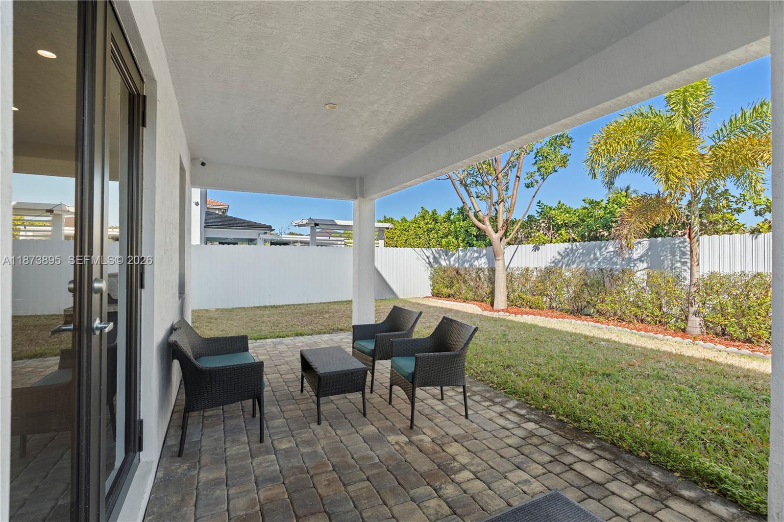 14841 Southwest 39th Terrace Miami, FL 33185 - Photo 52 of 57 a view of a chairs and table in a patio