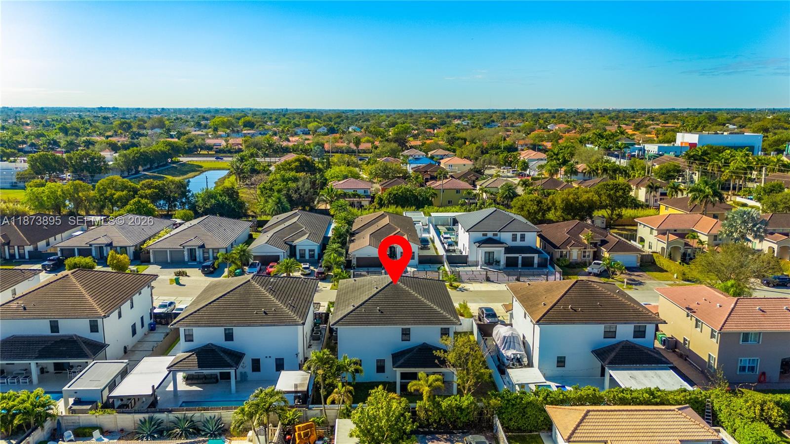 14841 Southwest 39th Terrace Miami, FL 33185 - Photo 55 of 57 an aerial view of residential houses with outdoor space and parking