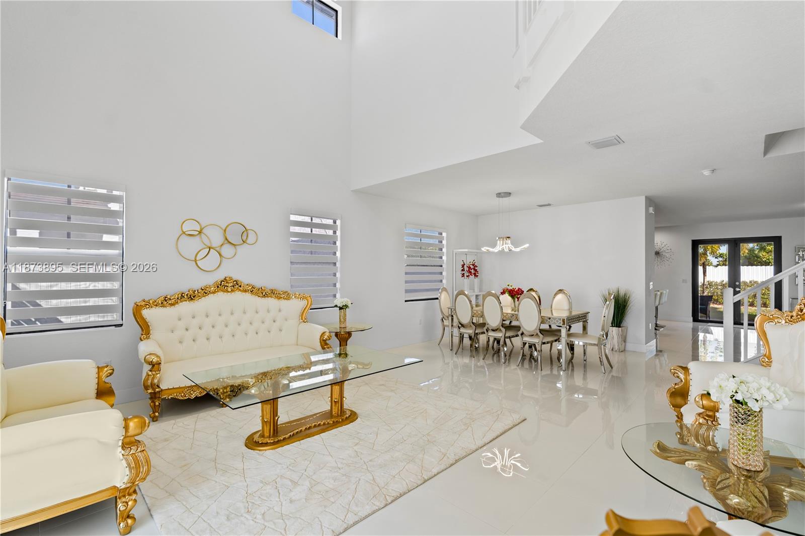 14841 Southwest 39th Terrace Miami, FL 33185 - Photo 8 of 57 a living room with furniture and a table