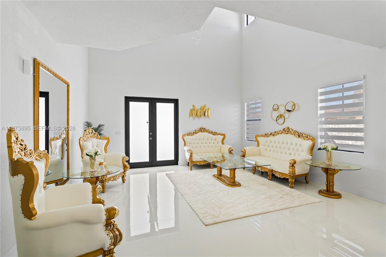 14841 Southwest 39th Terrace Miami, FL 33185 - Photo 10 of 57 a bedroom with furniture and a chandelier