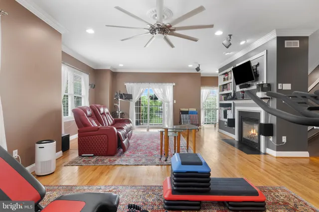 a kitchen with kitchen island granite countertop a stove and a sink