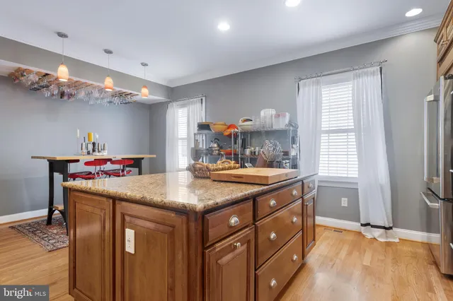 a view of a balcony with flower plants