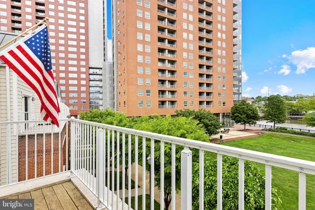 a bathroom with a sink toilet a mirror and window