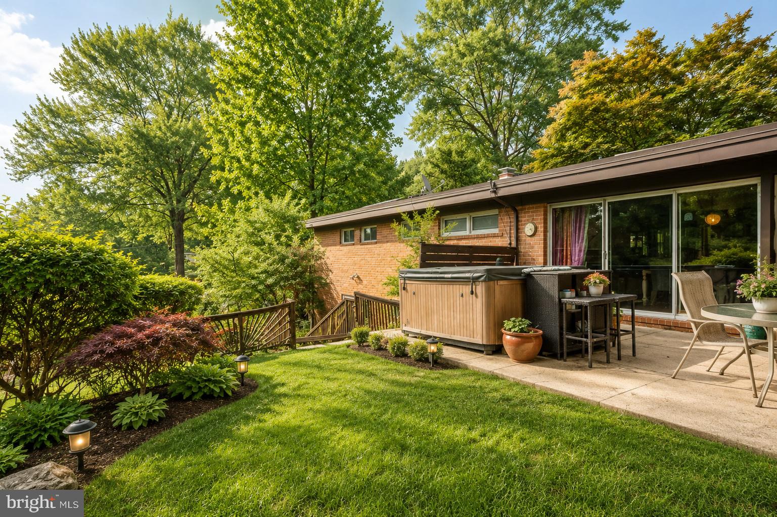 3228 Midfield Road Pikesville, MD 21208 - Photo 8 of 42 Serene backyard retreat with lush greenery.