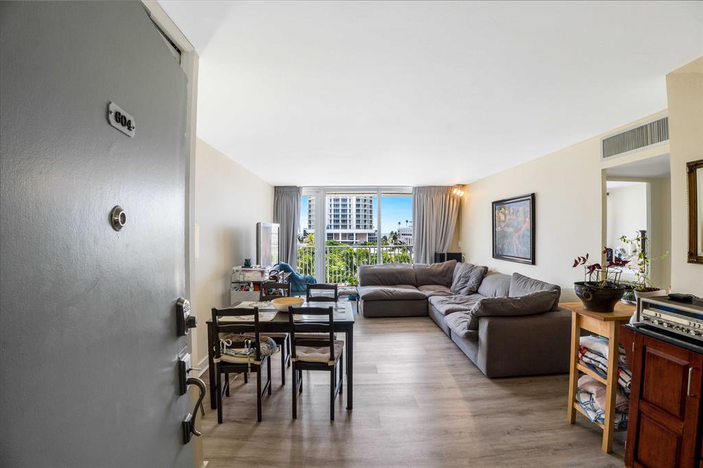 524 Orton Avenue, Unit 604 Fort Lauderdale, FL 33304 - Photo 3 of 24 a living room with furniture wooden floor and a large window