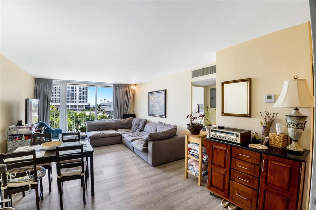 524 Orton Avenue, Unit 604 Fort Lauderdale, FL 33304 - Photo 4 of 24 a living room with furniture and wooden floor