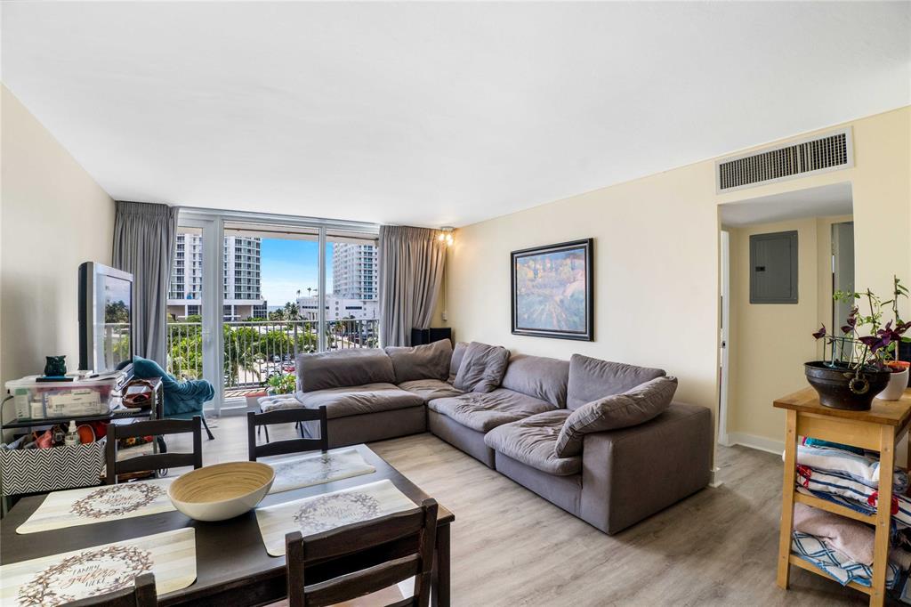 524 Orton Avenue, Unit 604 Fort Lauderdale, FL 33304 - Photo 5 of 24 a living room with furniture and wooden floor