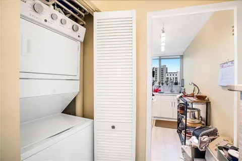 a bedroom with a bed and glass top door