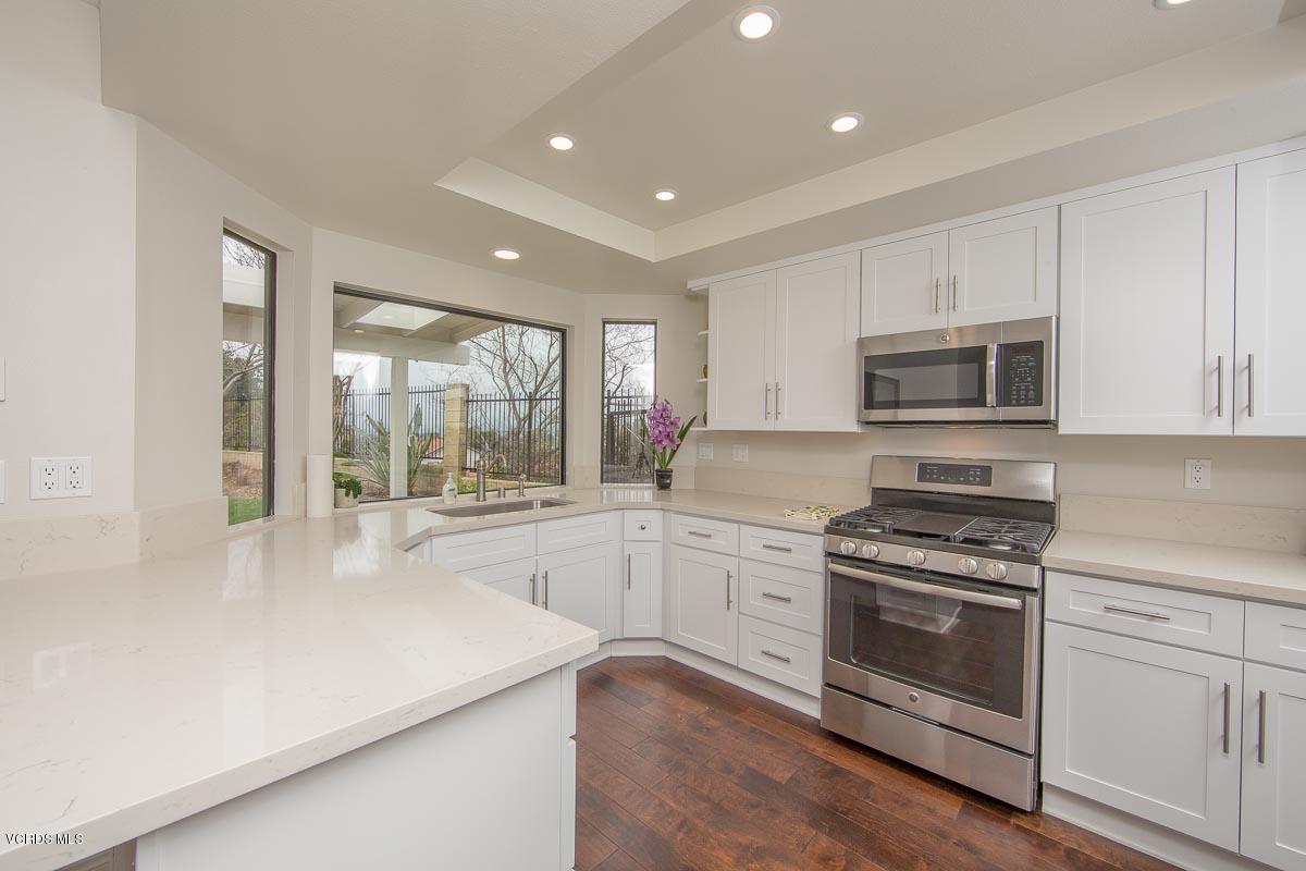 4265 Laurelhurst Road Moorpark, CA 93021 - Photo 12 of 47 a kitchen with sink a stove and microwave