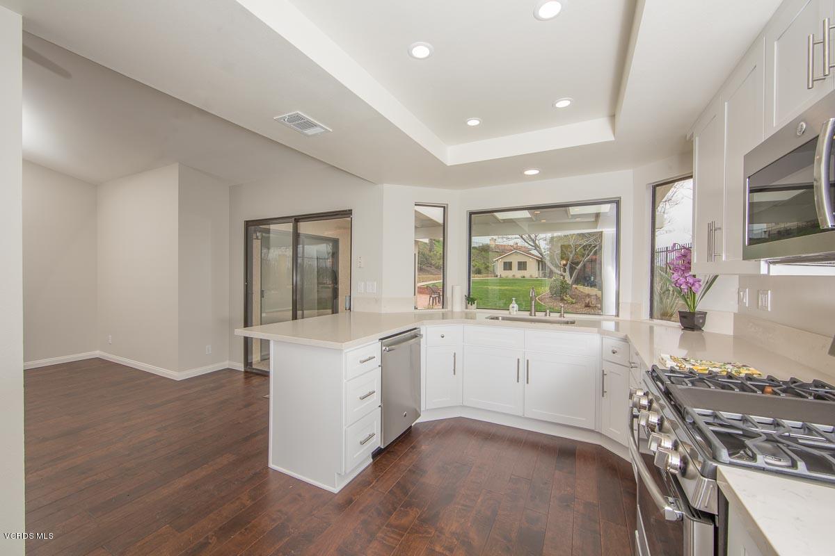 4265 Laurelhurst Road Moorpark, CA 93021 - Photo 13 of 47 a open kitchen with cabinets stove and a sink