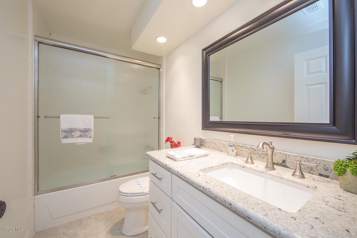 4265 Laurelhurst Road Moorpark, CA 93021 - Photo 15 of 47 a bathroom with a granite countertop sink toilet and shower