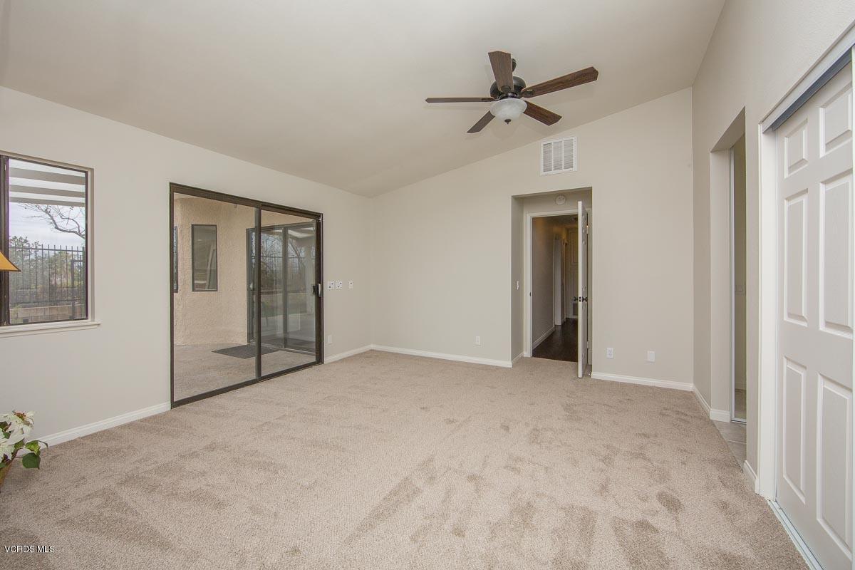 4265 Laurelhurst Road Moorpark, CA 93021 - Photo 22 of 47 a view of an empty room with a ceiling fan and windows