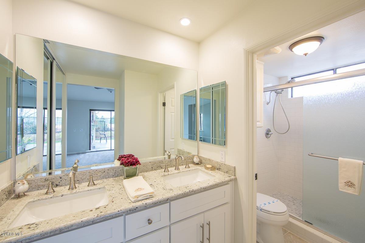 4265 Laurelhurst Road Moorpark, CA 93021 - Photo 24 of 47 a bathroom with a granite countertop sink toilet and shower