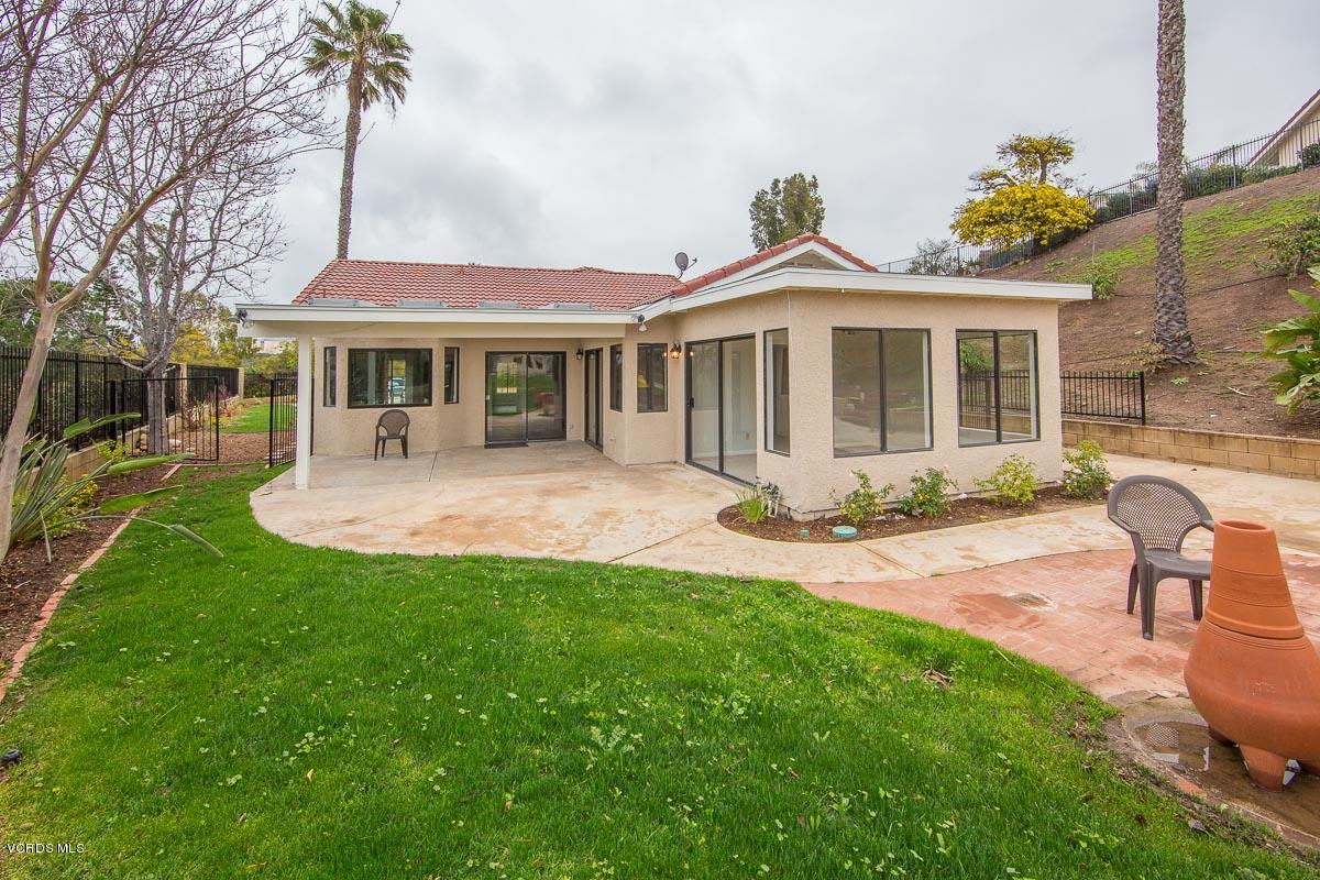 4265 Laurelhurst Road Moorpark, CA 93021 - Photo 30 of 47 a front view of a house with a garden and yard
