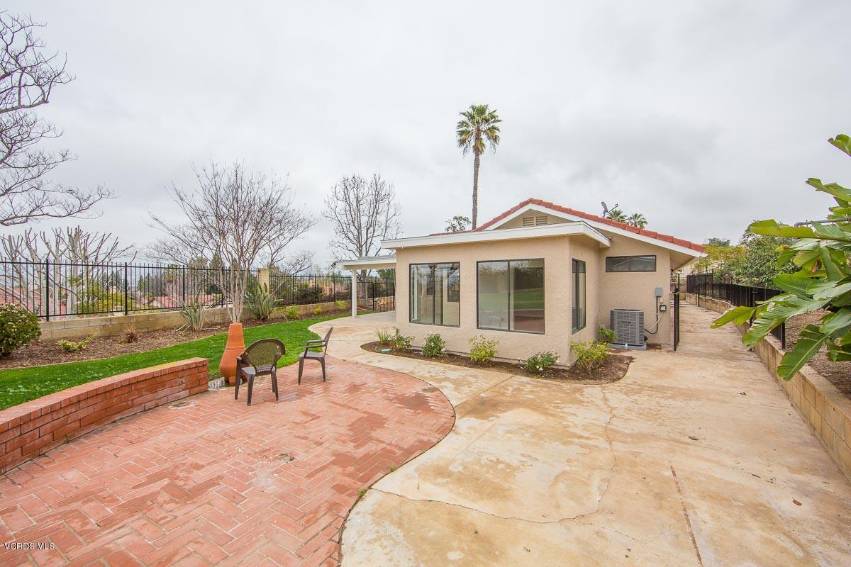 4265 Laurelhurst Road Moorpark, CA 93021 - Photo 31 of 47 a front view of a house with a garden and outdoor seating