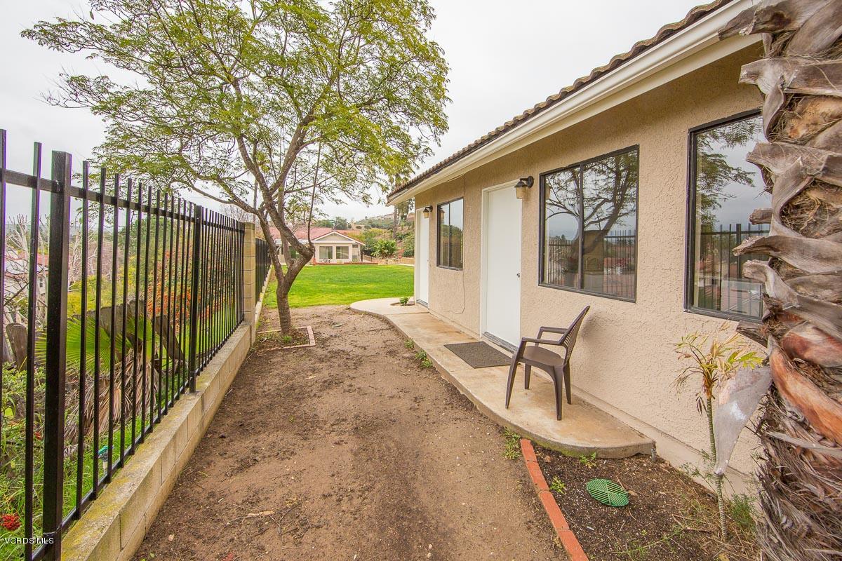 4265 Laurelhurst Road Moorpark, CA 93021 - Photo 35 of 47 a view of a patio with a table and chairs and wooden fence
