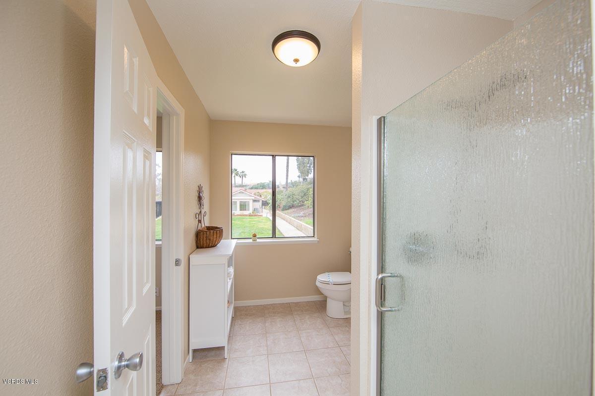 4265 Laurelhurst Road Moorpark, CA 93021 - Photo 40 of 47 a spacious bathroom with a toilet sink and a large mirror