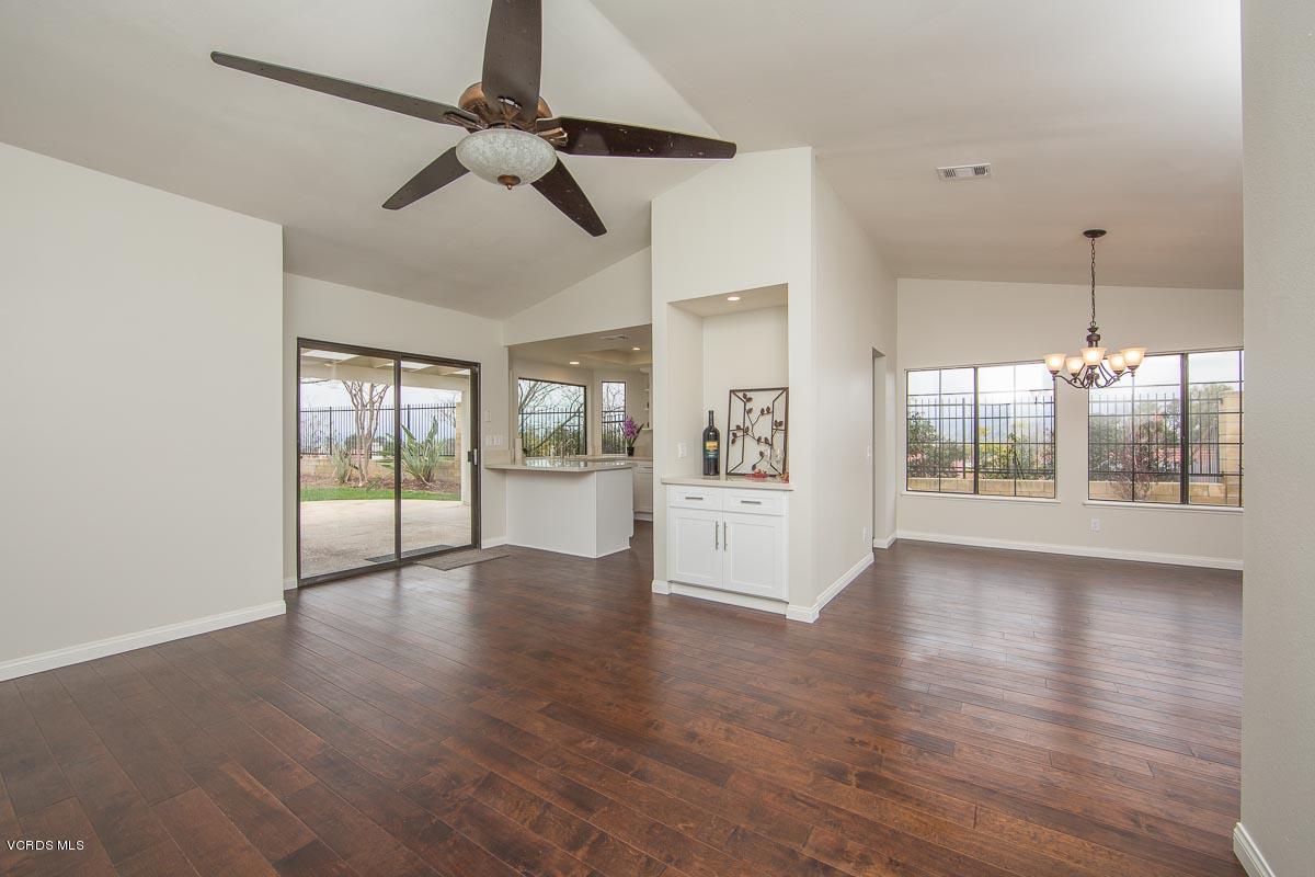 4265 Laurelhurst Road Moorpark, CA 93021 - Photo 9 of 47 a view of an empty room with wooden floor and a window