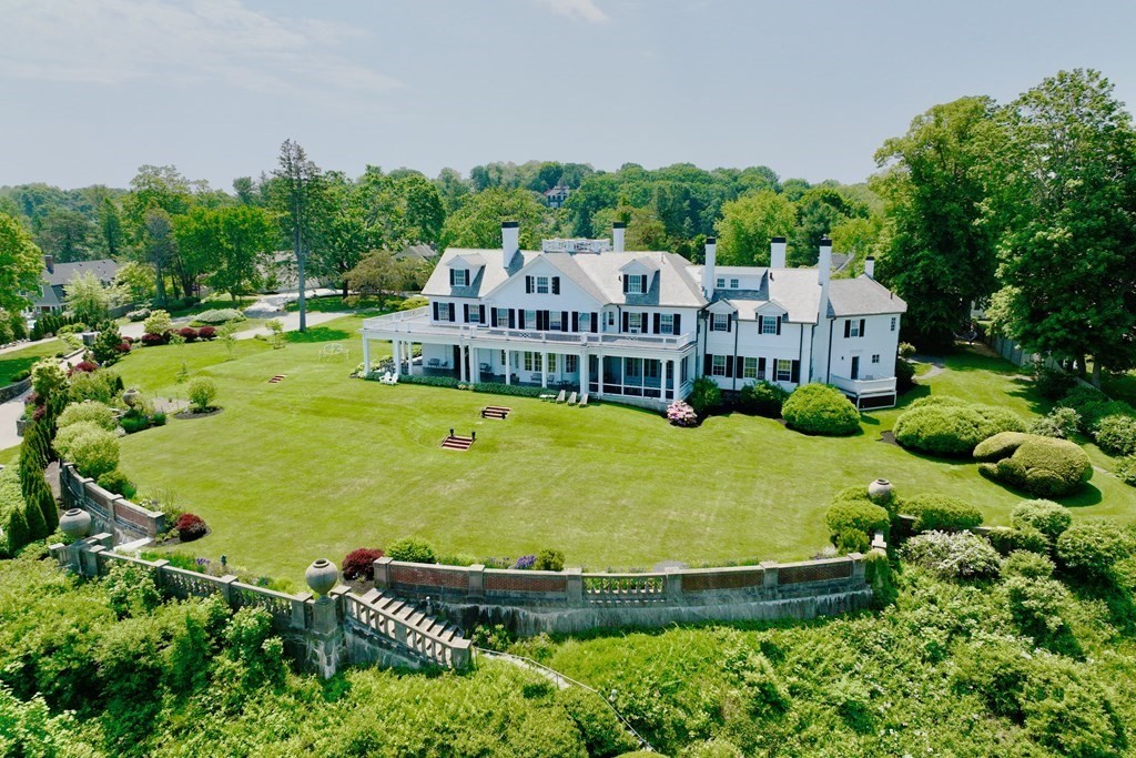 an aerial view of a house with swimming pool garden and outdoor seating