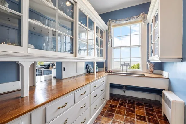 a kitchen with stainless steel appliances a sink and cabinets