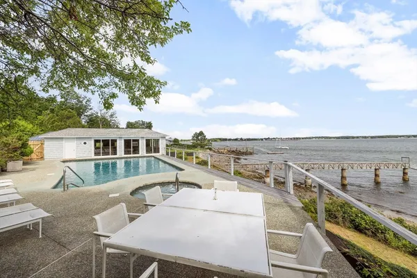 a view of a roof deck with furniture