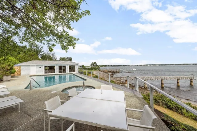 a view of a roof deck with furniture