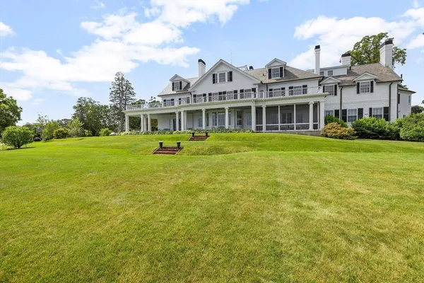 a front view of a building with a garden