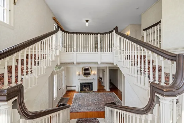 a view of an entryway with wooden floor