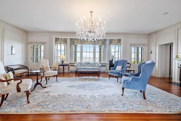 a living room with furniture and a dining table