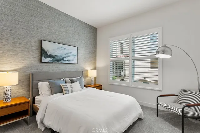 a bedroom with bed and a window