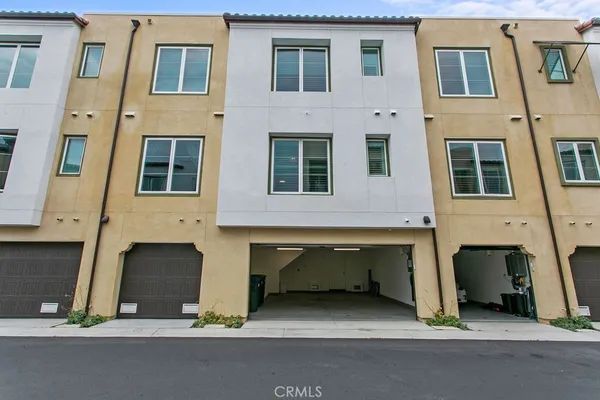 a front view of building with multiple windows