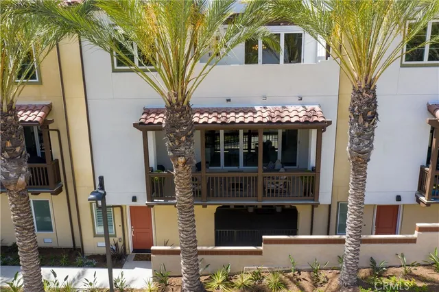 a front view of a house with lots of trees