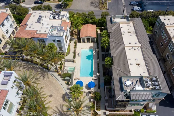 an aerial view of a residential apartment building with a yard