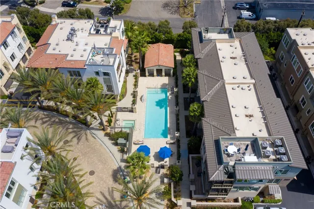 an aerial view of a residential apartment building with a yard