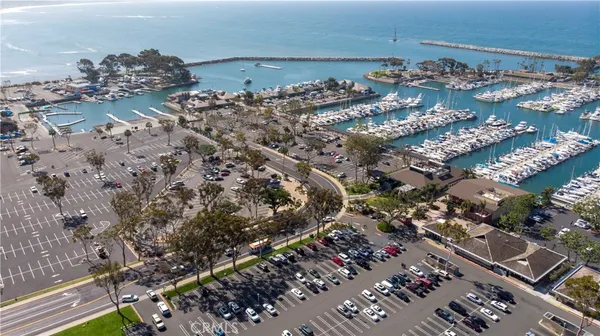 a view of a street with cars parked