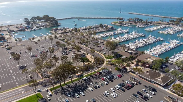 a view of a street with cars parked