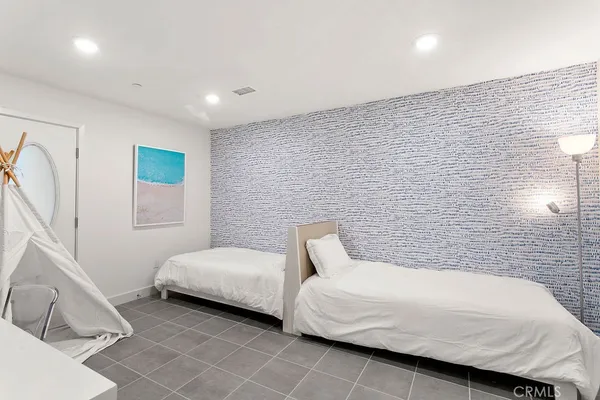 a bedroom with a bed and a couch