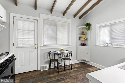 a kitchen with stainless steel appliances a stove a refrigerator and a refrigerator